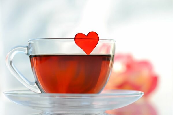 A heart in a cup of tea on a saucer