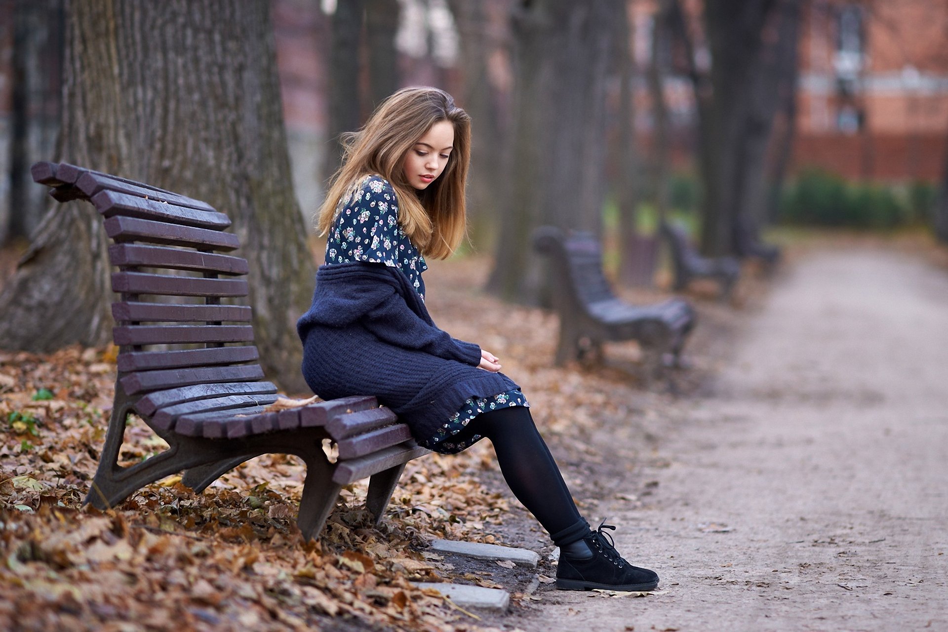 late autumn fallen leaves park shop thoughtful girl