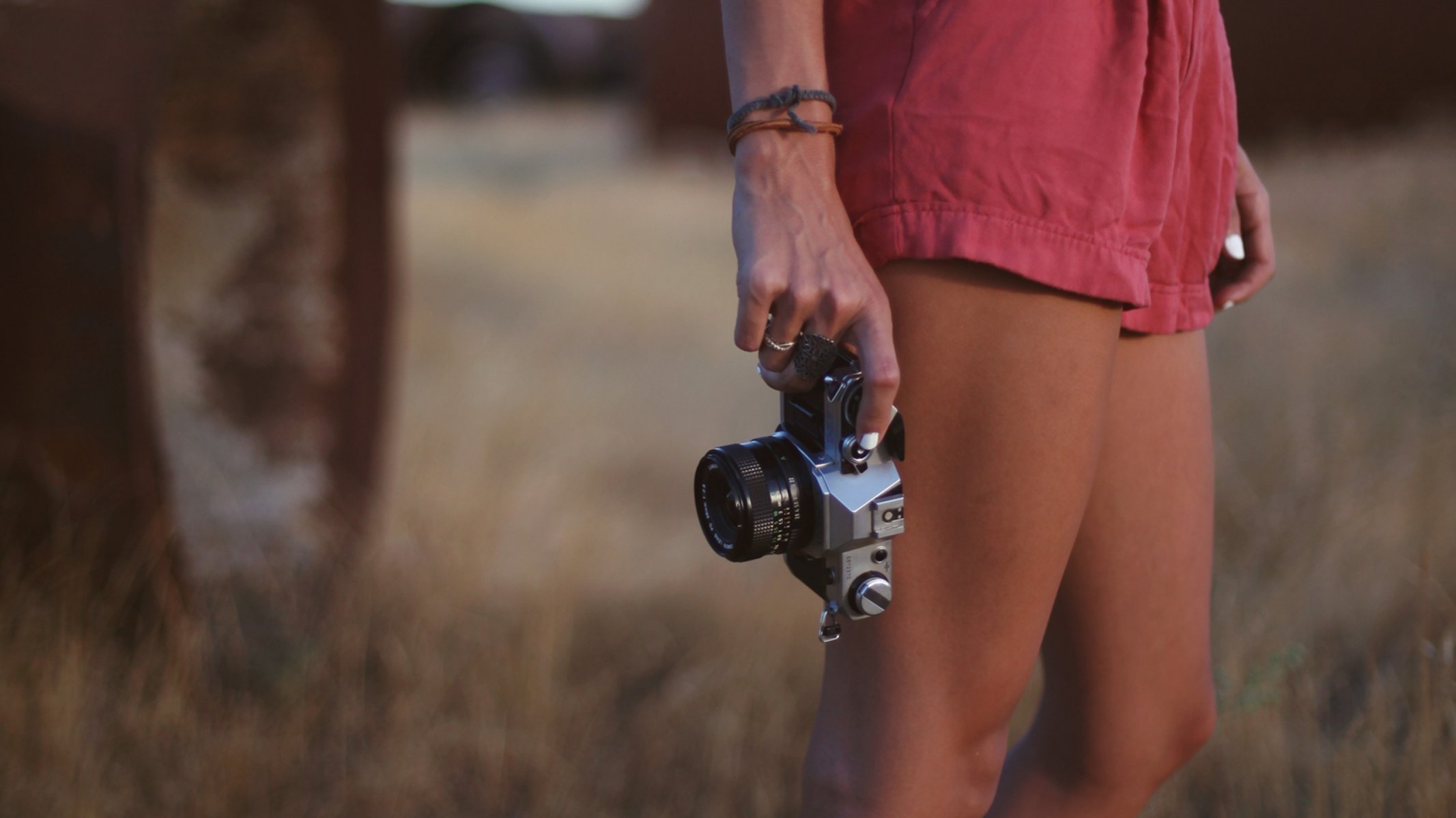 mood girl legs camera hands bracelets nature grass plant background wallpaper