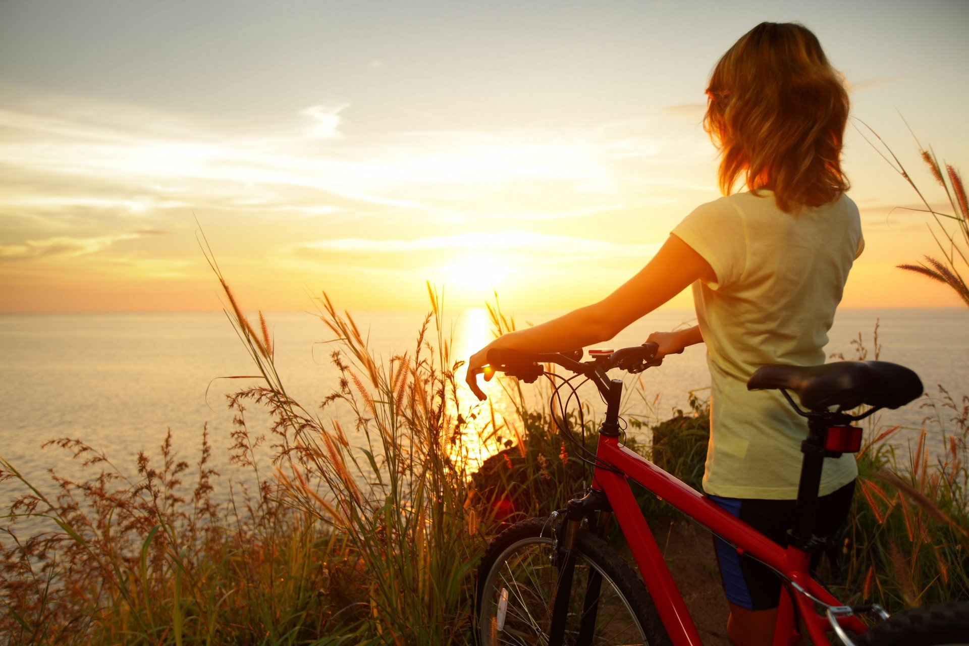 mood girl girl woman sport bike nature rye wheat sunset sun sky clouds sea river water reflection background widescreen fullscreen widescreen wallpaper