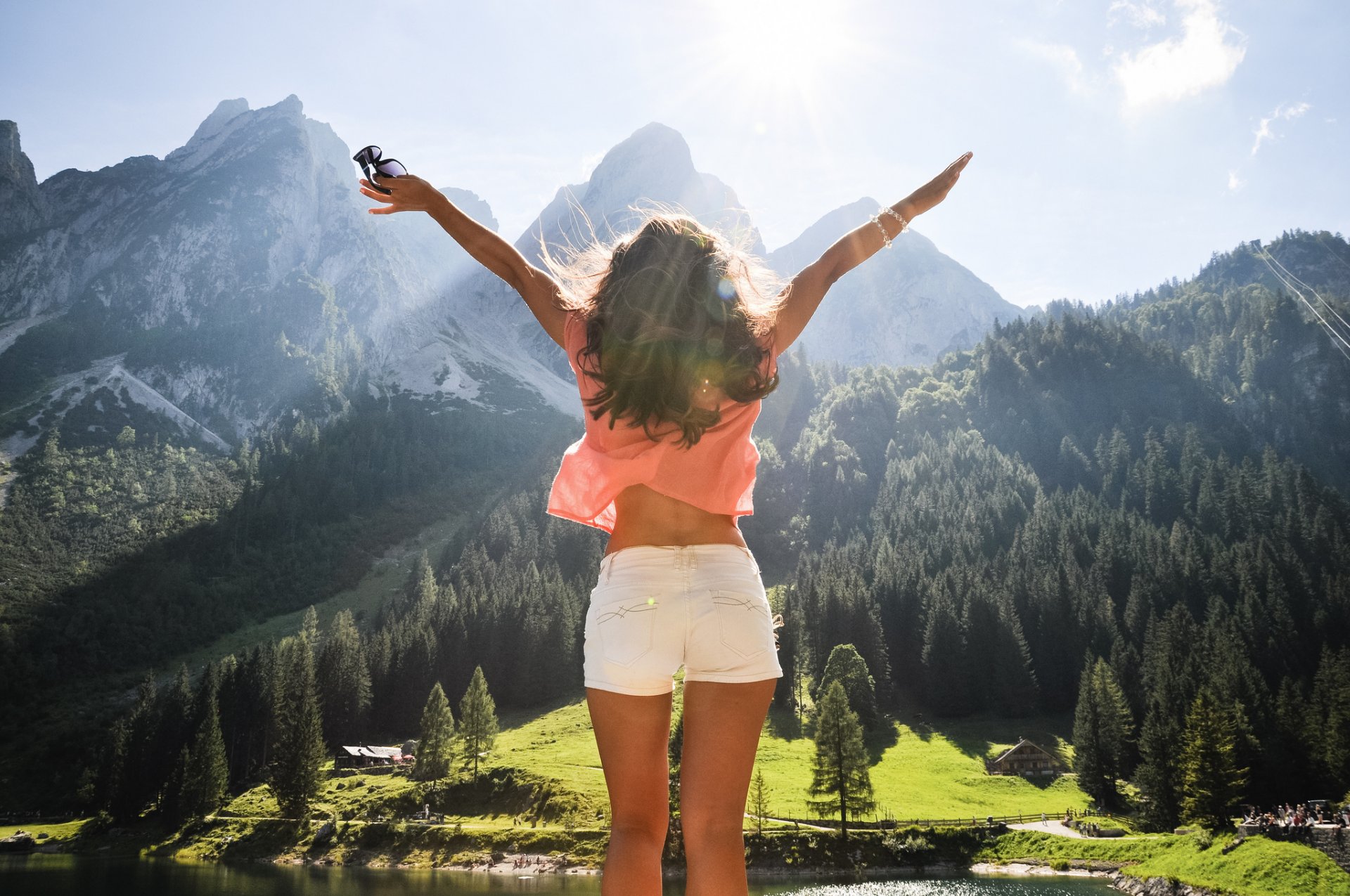 girl happiness freedom austria mountain forest tree lake height panorama views sky clouds sunny light ray