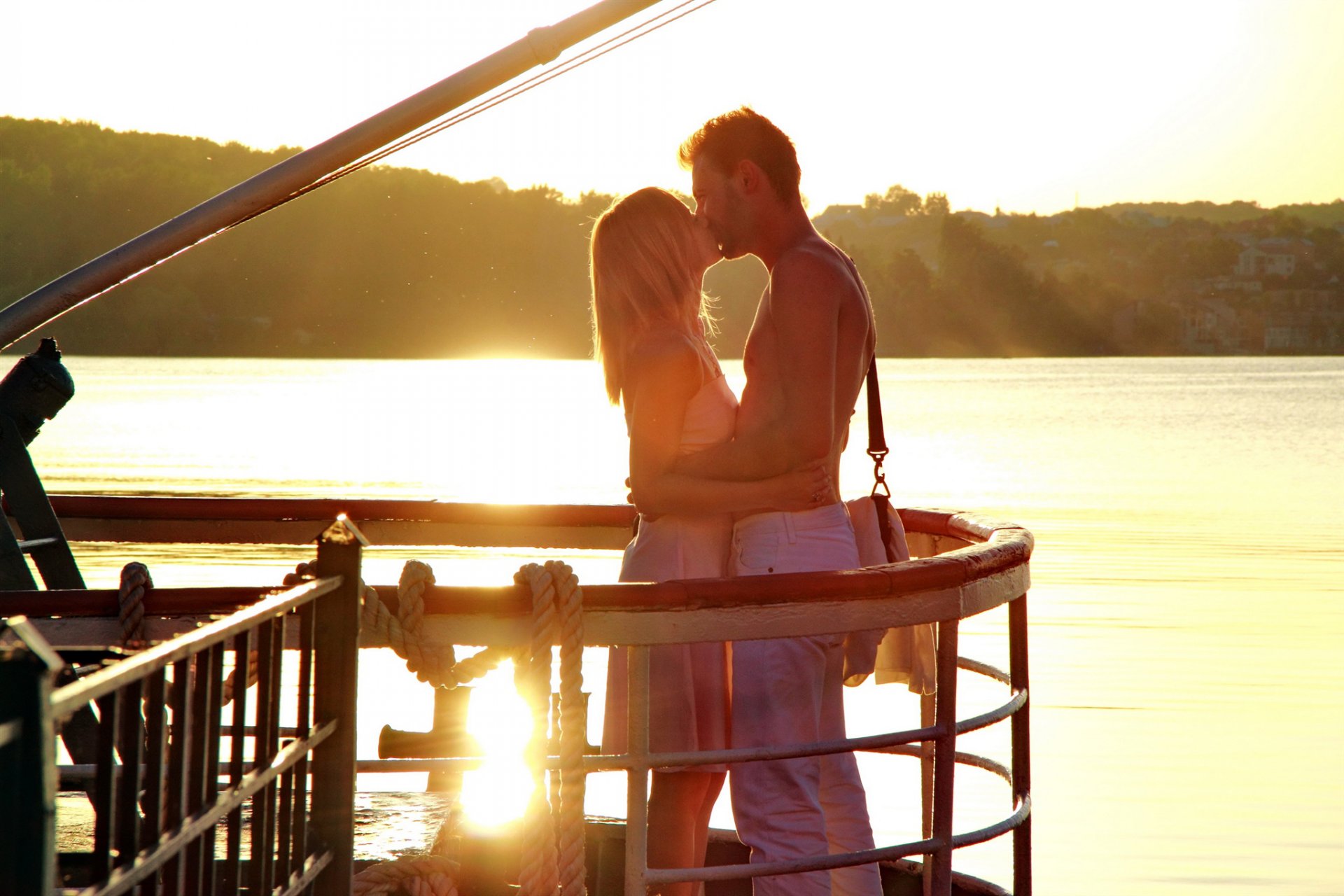 guy girl kiss love relationship intimacy the pair river water nature sun light sunset romance positive