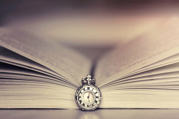 The clock is a bookmark for reading a book