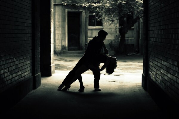 Beautiful couple dancing on the street