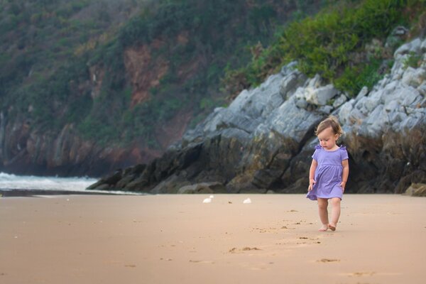 Baby s walk along the ocean