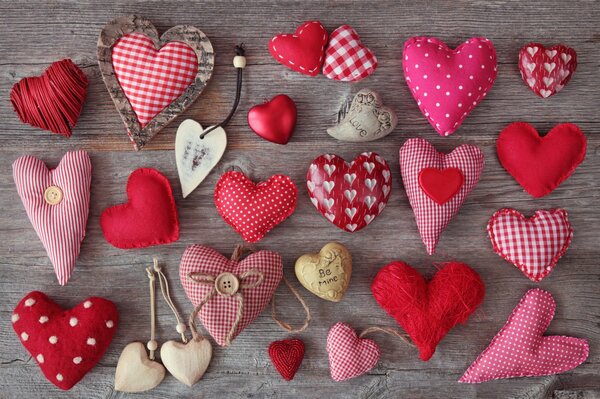 Beautiful handmade hearts on a gray - brown background