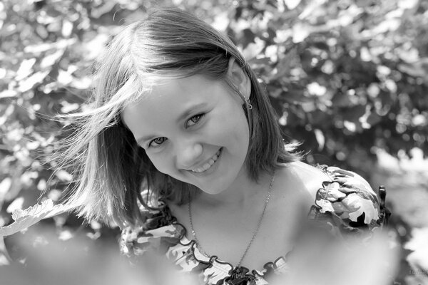 Black and white portrait of a smiling girl