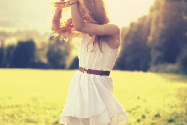 Blonde girl in a white dress with a belt