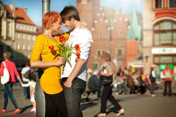 A guy and a girl. A joyful meeting in the city