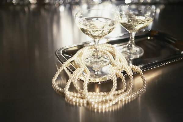 Champagne glasses and pearl beads