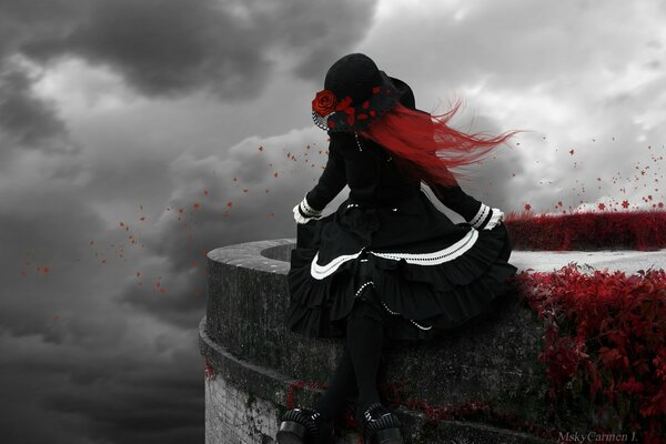 A girl in a Gothic Lolita costume against a background of clouds
