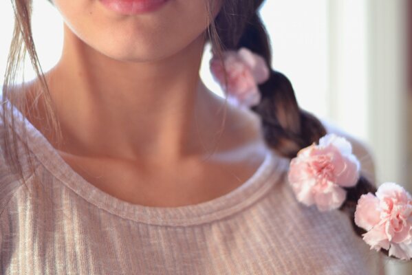 A girl s hairstyle with rose flowers