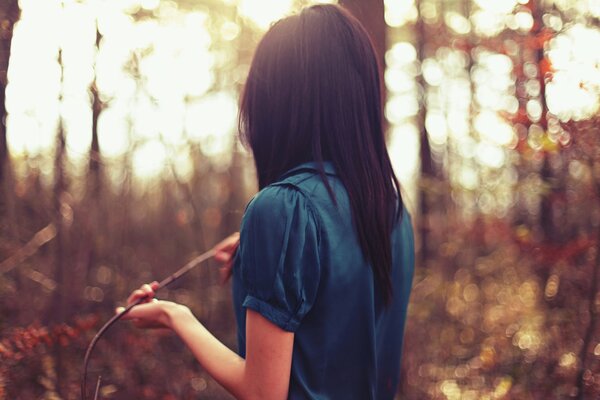 The girl in blue in the forest