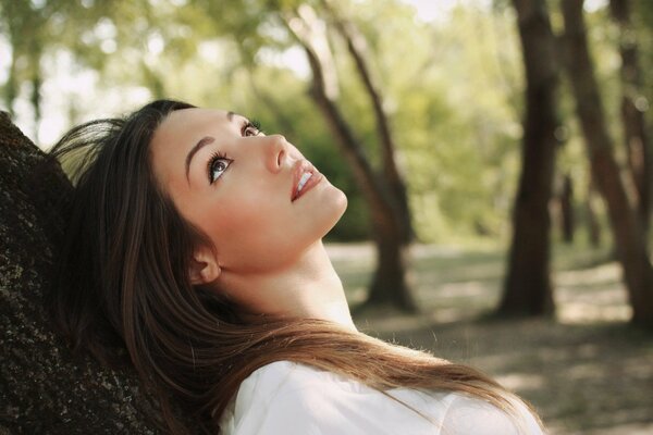 Beautiful girl looks up