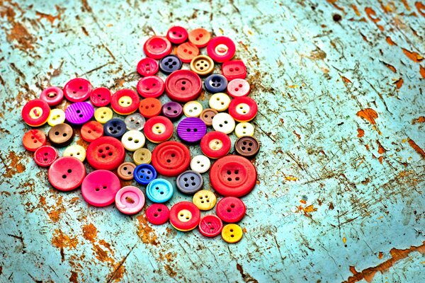 Heart of colored buttons on the table