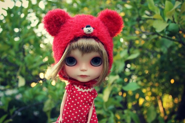 Doll in a red riding hood with big eyes
