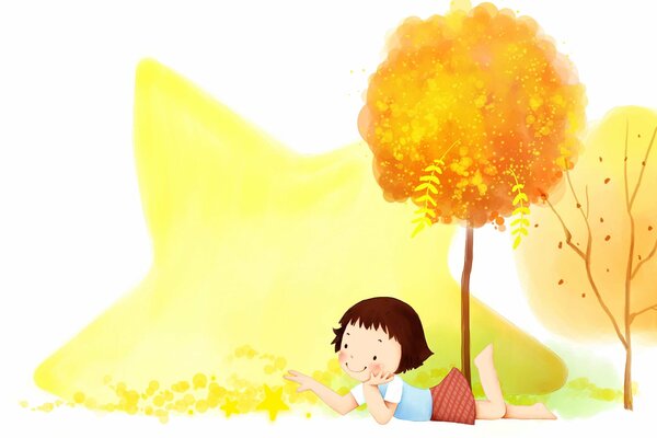 Lindo bebé de dibujos animados yace en la hierba debajo de un árbol y juega hojas caídas