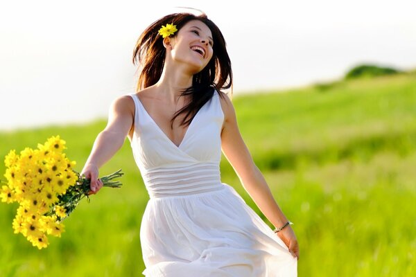 Happy girl with a bouquet of daisies