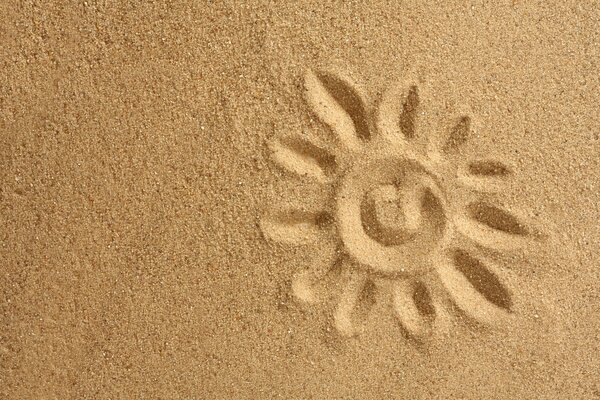 Painted sun on golden sand