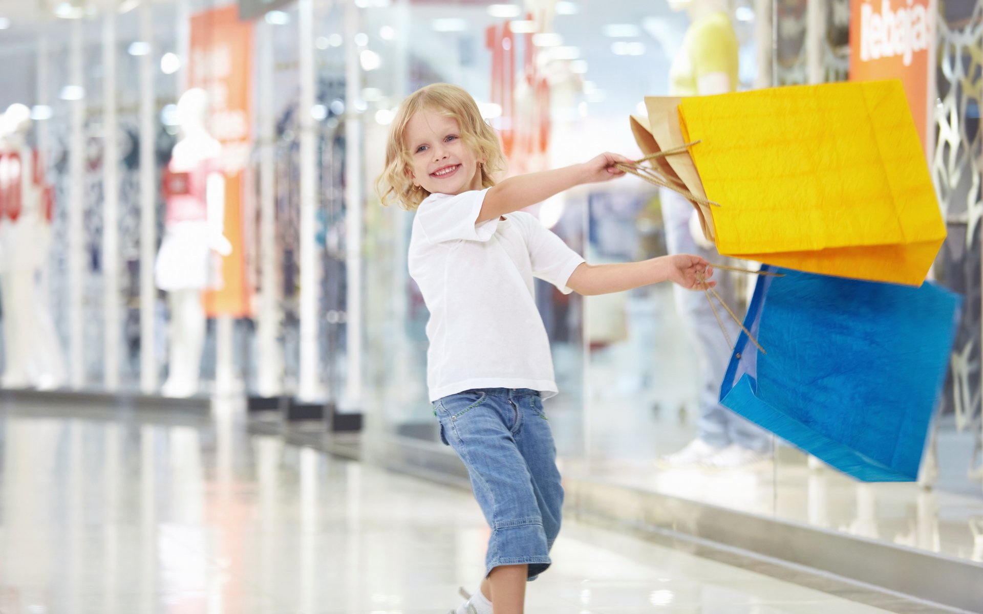 girl child joy happiness smile laughter packages shopping shopping yellow blue