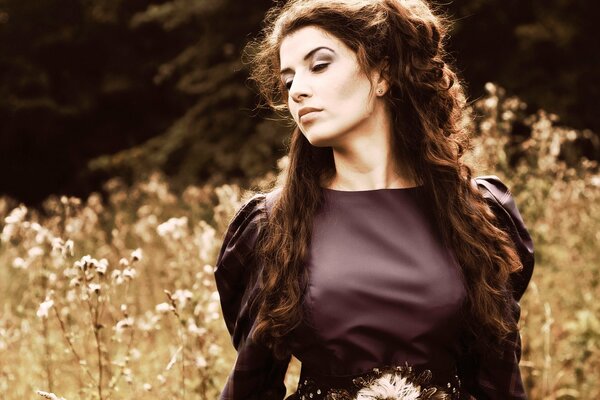 Thoughtful girl in a gothic dress