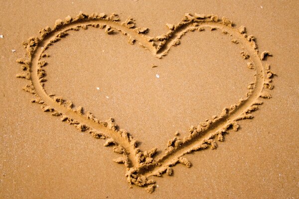 A big heart painted on the sand