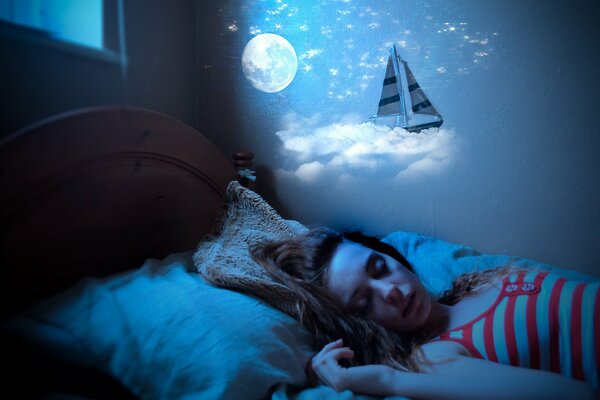 A sleeping girl watches fabulous dreams about the moon and a heavenly sailboat