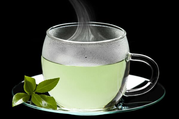 Mug with hot green tea