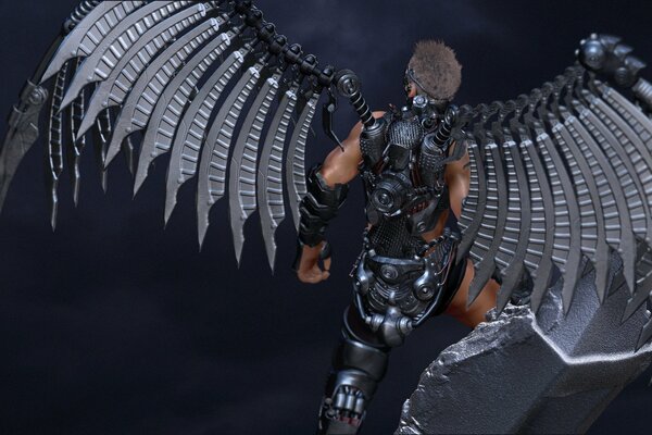 Angel in armored metal wings