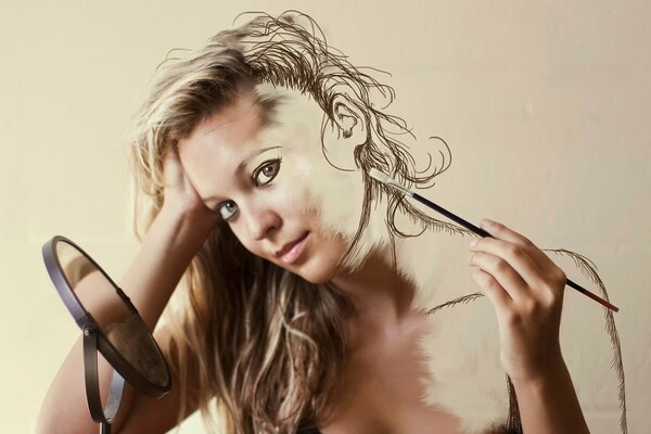 The girl draws herself with a brush, looking in the mirror