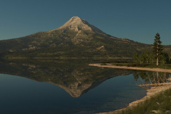 The mountain is reflected in the surface of the lake