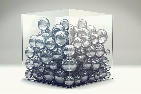 A glass cube filled with balls