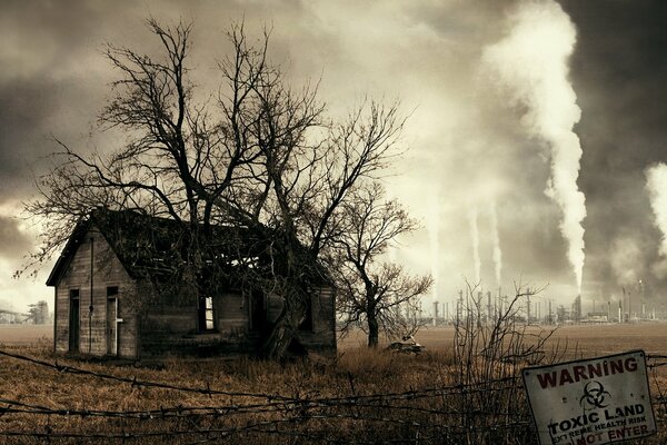 An abandoned house behind barbed wire