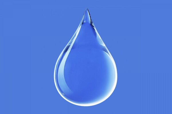 Transparent drop of water on a blue background