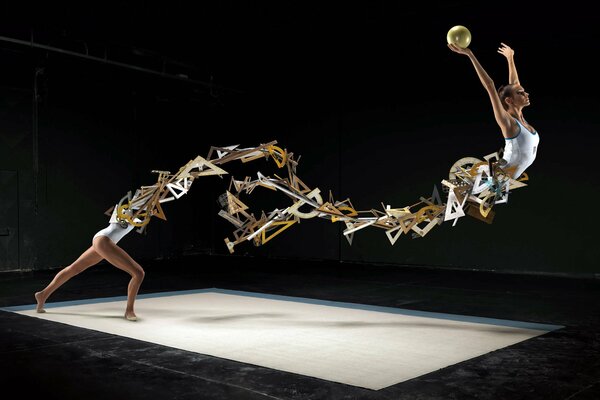 Foto abstracta de una gimnasta con un balón de oro