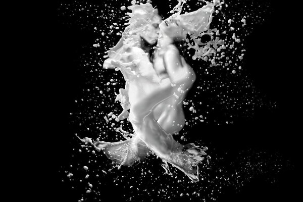 Milk splashes into man and woman