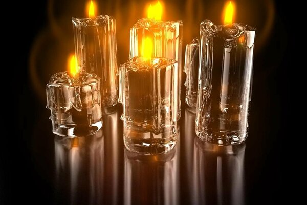 Transparent candles. Reflection of fire