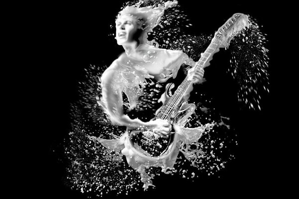 A guitarist painted with drops of milk