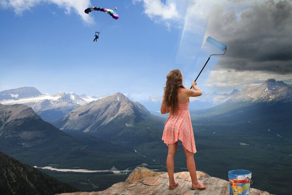 La jeune fille colore le ciel de couleurs