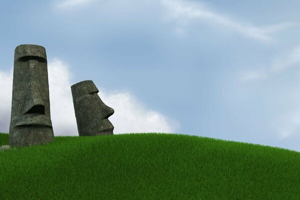 Statues on Easter Island on the grass