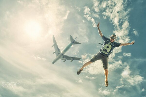 Jump from a plane of a man with a parachute