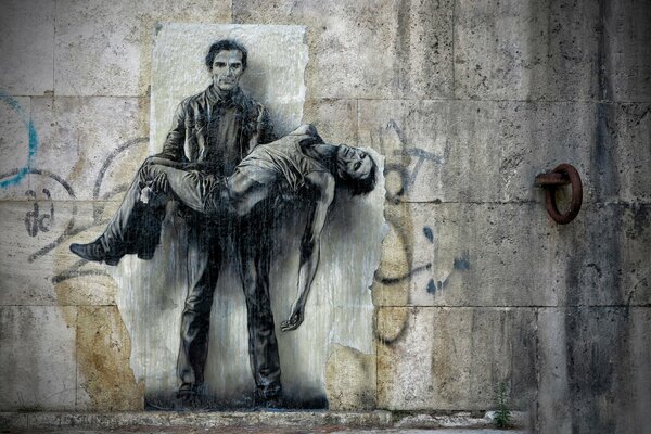 Рисунок мужчин на бетонной стене