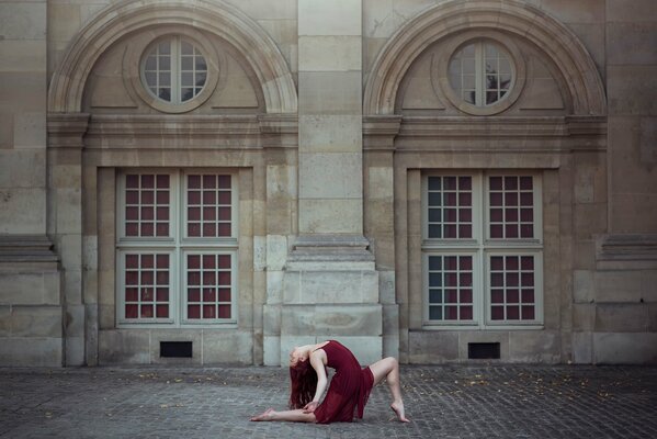 A girl dancing in a red dress