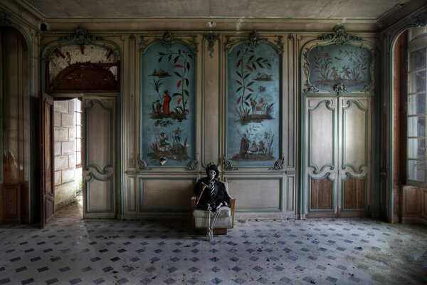 A skeleton sitting in the castle hall