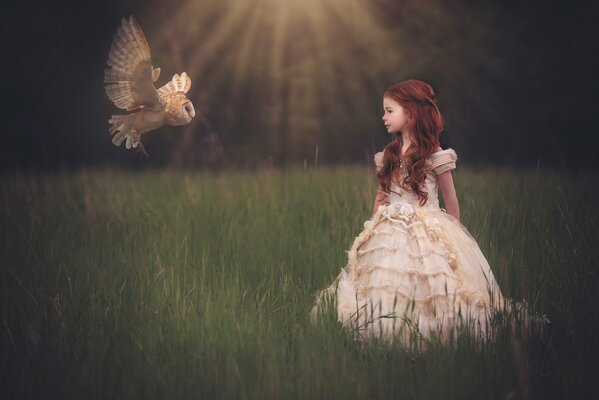The girl and the owl they are friends called and he flies