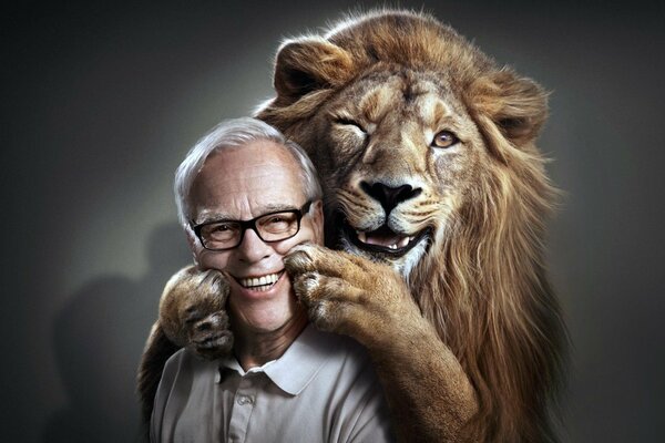 Photo of a lion embracing a man