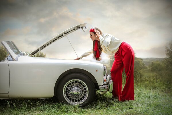 Cute, attractive girl and car breakdown