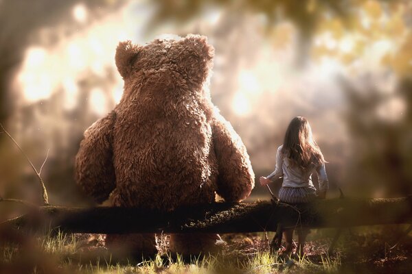 Gros ours et petite fille ne sont pas assis sur une branche d arbre