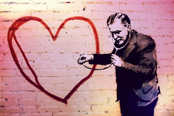 Graffiti depicting a doctor listening to a painted heart