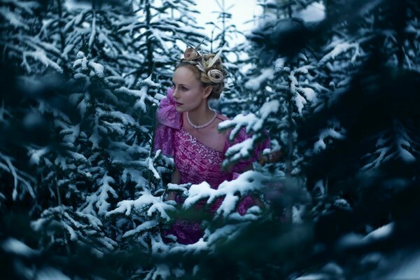 The sorceress in winter in the snowy forest